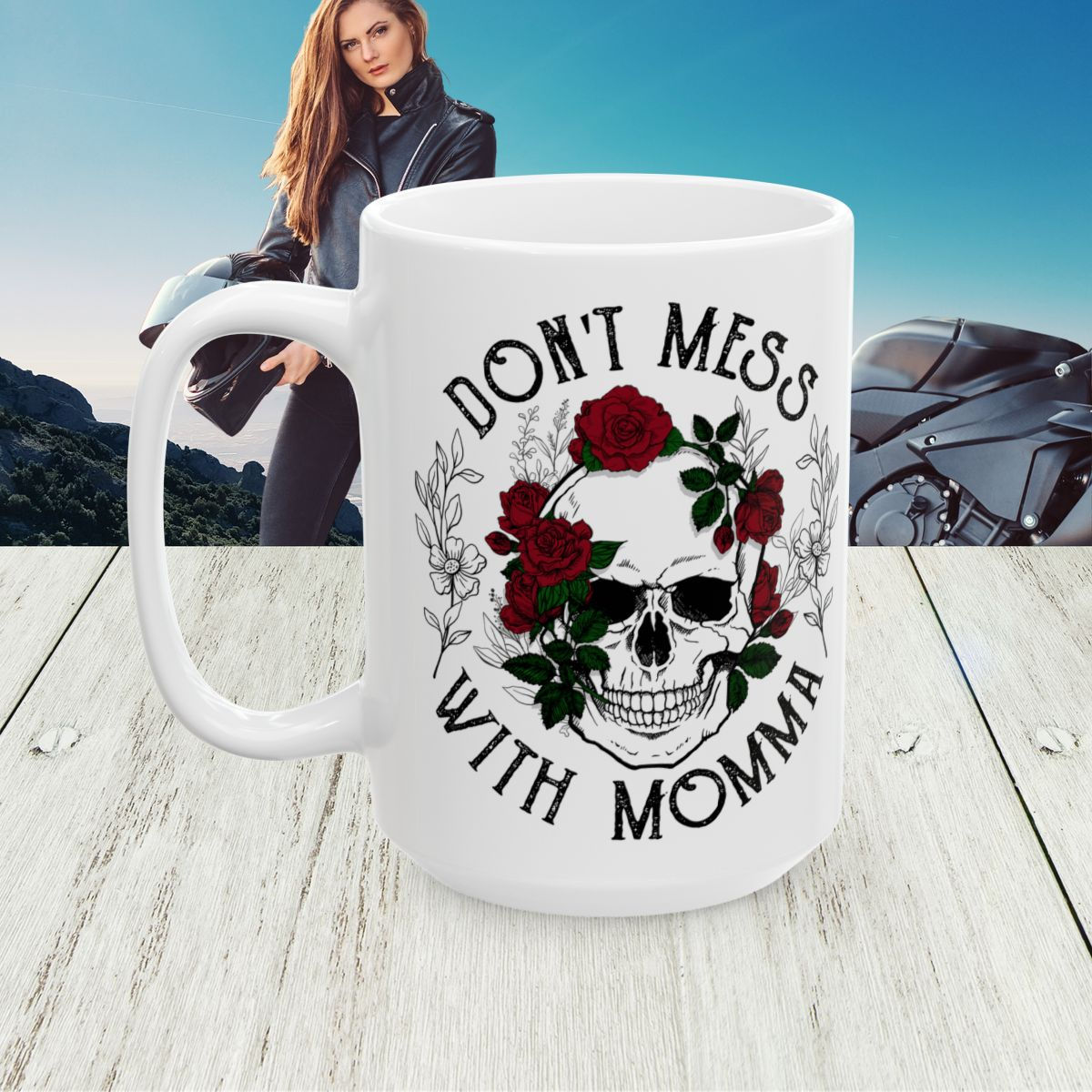 Don't Mess With Momma Roses Mug on a deck with a biker momma in the background.