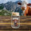 Thumbnail: Good Morning Y'all Glass Tumbler on a wood deck with a cow looking at the glass cup mountains in the background.