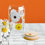 Thumbnail: Daisies Sipper Glass on a counter surrounded by daisies show the bamboo lid and straw