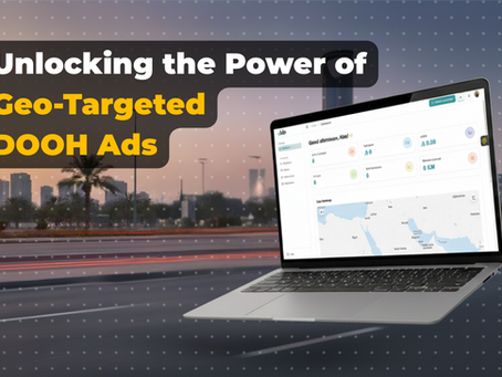 Laptop displaying dKilo dashboard showing Saudi Arabia map and campaign data, with a geo-targeted DOOH ad message overlay on a city background.