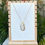 Thumbnail: Large White Shell with Gold Accents Pendant