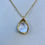 Thumbnail: Small White Shell with Gold Accents Pendant