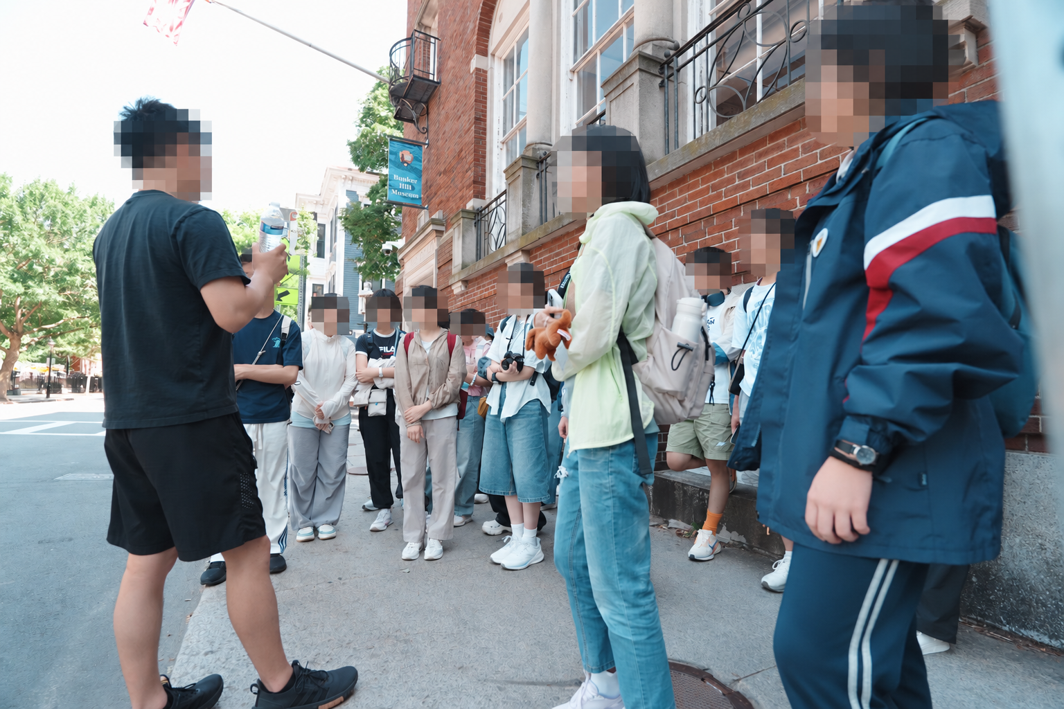 Previous programme visit outside Boston’s Bunker Hill Museum; faces obscured for privacy