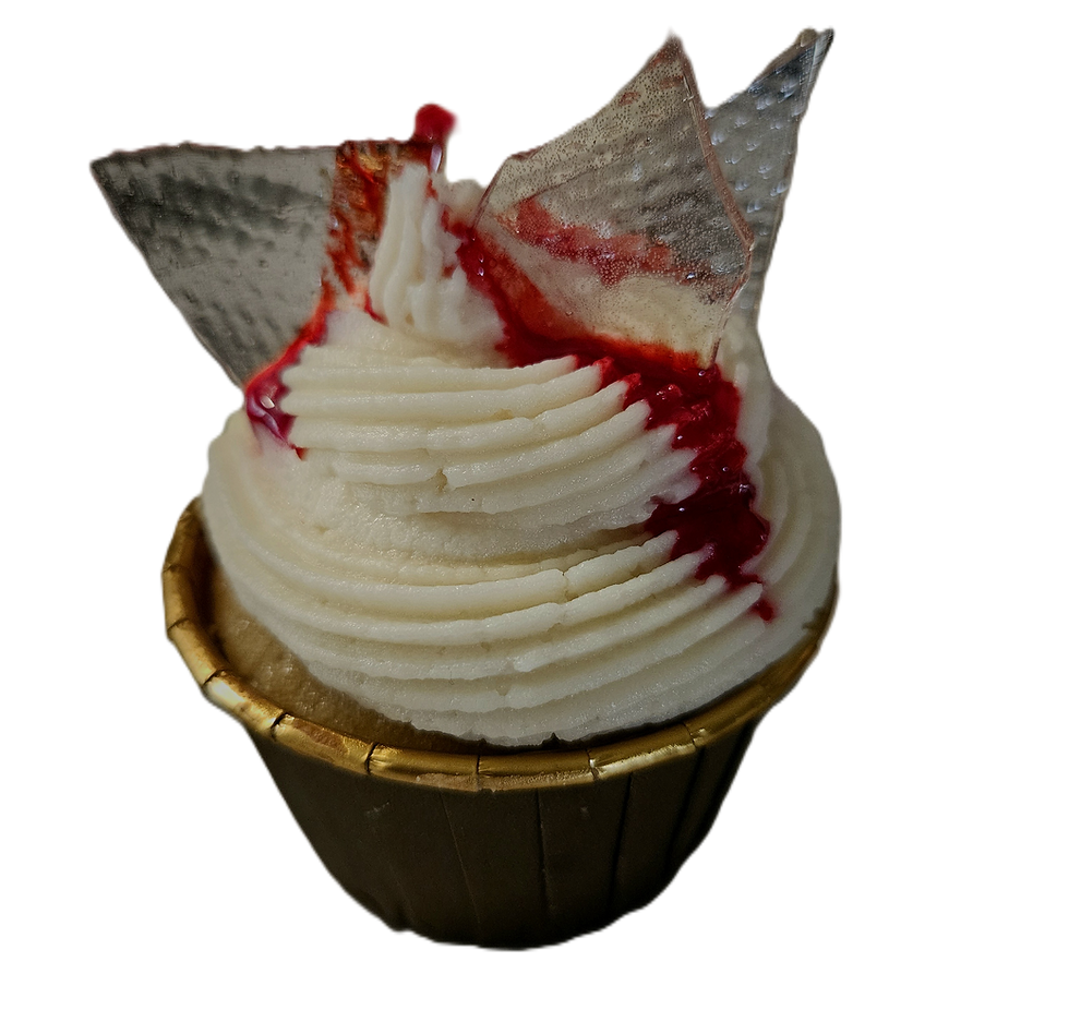 Strawberry cream cheese cupcake with red drizzle and candy glass shards