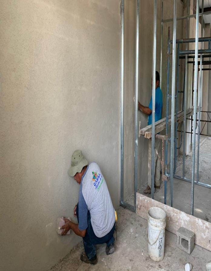 Some masons helped doing stucco.