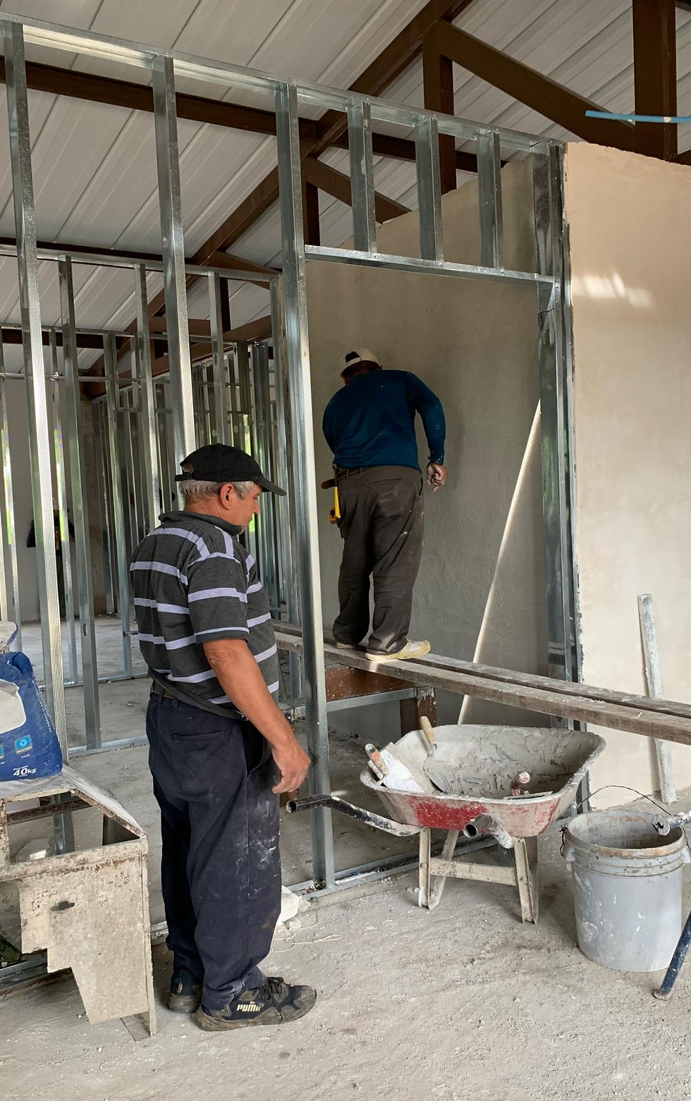 Some masons helped doing stucco.