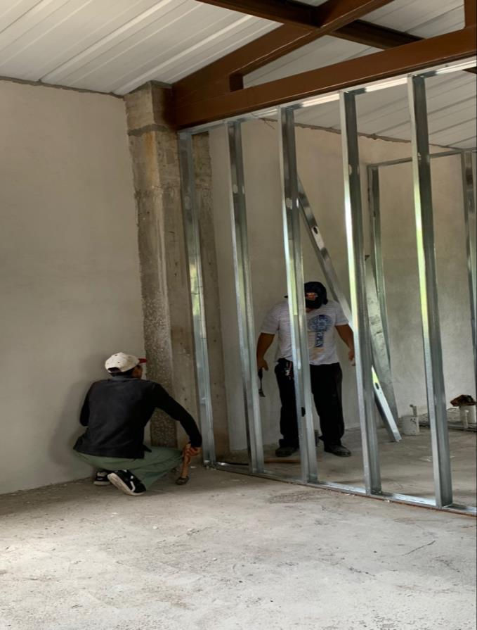 Some masons helped doing stucco.