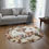 Thumbnail: Flora the Baby Deer Florist Round Area Rug (Laying Down) | Kiki Baby