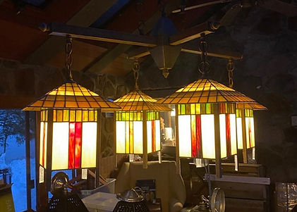 The dining room chandelier that unexpectedly led Lamar and Terri to discover and purchase Babbling Brook Cottages.