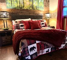 Cozy queen bedroom with woodland-inspired décor at Bear Claw Cabin in Dingmans Ferry, Pennsylvania