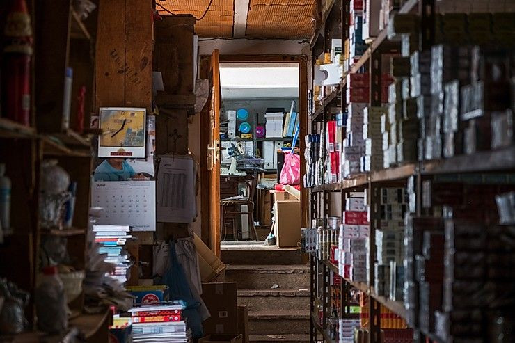 A small room is filled with boxes and other old items.