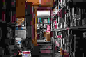 A small room is filled with boxes and other old items.
