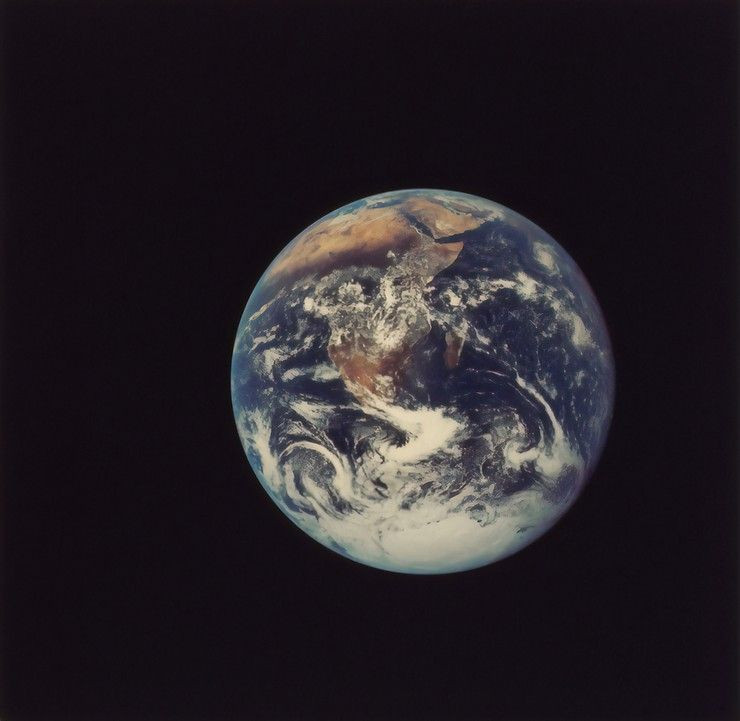 The Earth is pictured from space with a black background.