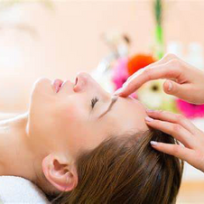 A woman getting access bars therapy.