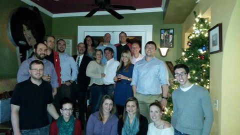 Group Christmas photo; colleagues and friends celebrating