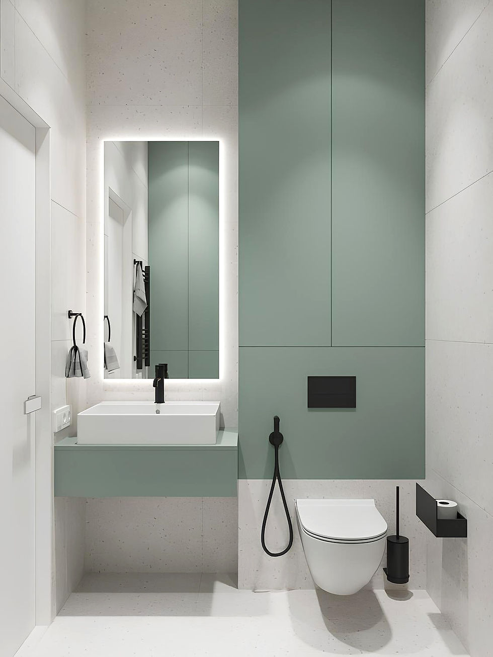 Petite salle de bain vert sauge : meuble et placards verts, miroir rétro-éclairé, faïences blanches et robinetterie noire, style minimal et actuel.
