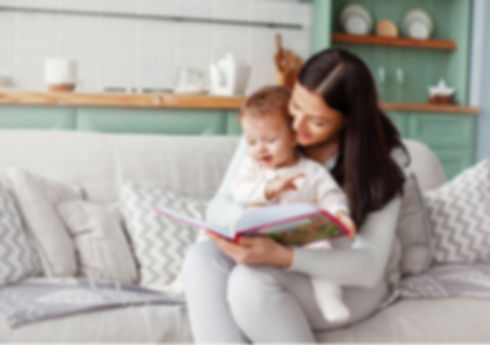 Image of a mother reading to her child