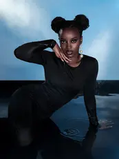 dark skin make- up with a afro bun
water shoot