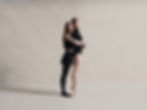 Two ballet dancers hugging