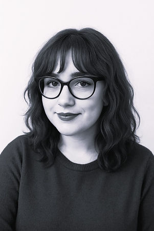 Photo of young woman smiling and wearing glasses