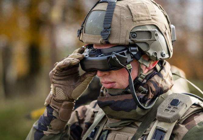 Professional defence photography of French soldier with FPV Drone