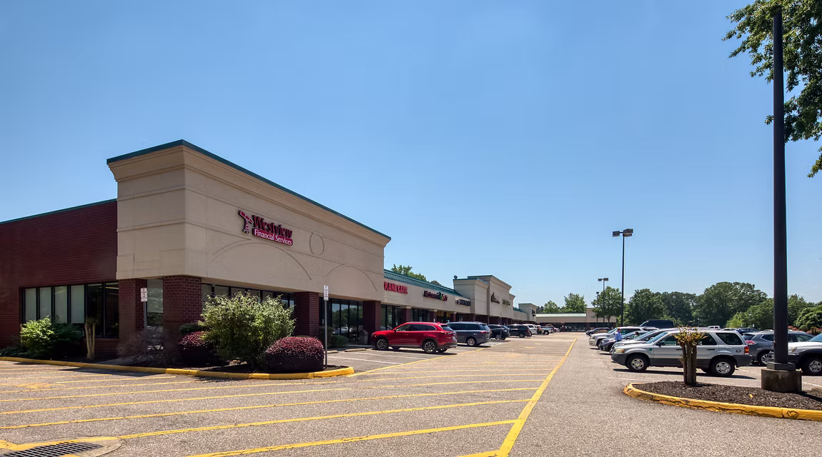 Villages Kiln Creek retail center exterior with Parks Orthodontics, landscaped areas, accessible parking, and storefronts