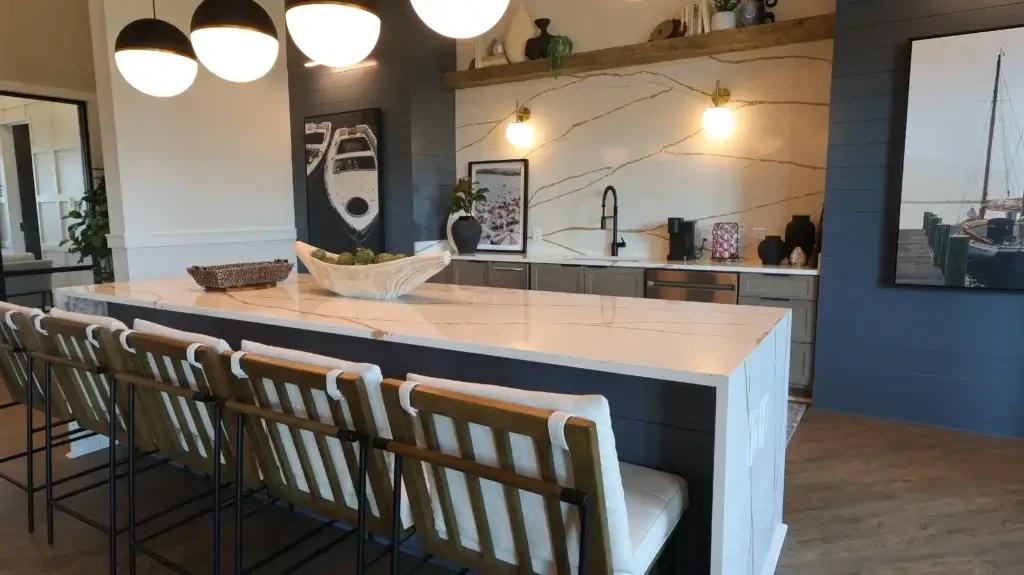 The Landing at Coventry clubhouse kitchen with large island, bar seating, modern lighting, and lounge-style finishes