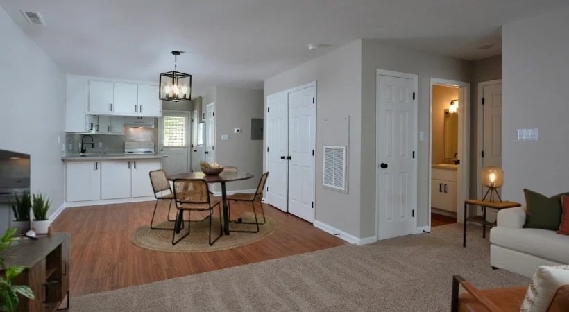 Edgewood Apartments open floor plan with dining area, kitchen, living space, wood-style flooring, and neutral finishes