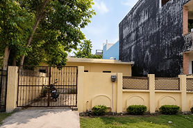 100 sq mtr residential land for sale in Alpha 2 Greater Noida with gated frontage and developed residential surroundings listed by Shiva Associates.