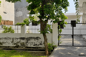 200 sq mtr residential land for sale in Alpha 2 Greater Noida with gated frontage, mature trees, and established residential surroundings. Listed by Shiva Associates, trusted property dealers in Greater Noida.