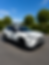 Side profile of Toyota RAV4 XLE 2023 with black wheels, roof rack and tinted windows