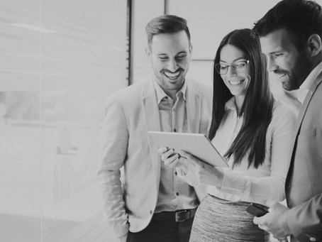 black and white image of a sales team preparing for a corporate event