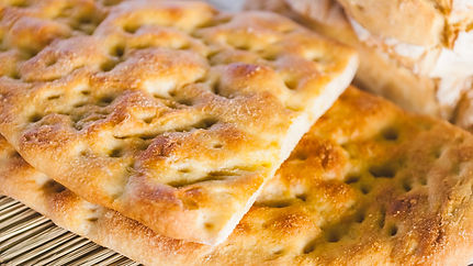 schiacciata-is-a-thinner-chewier-focaccia-with-less-water-and-a-deeper-crisp-1666121006.jp