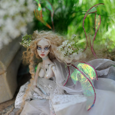 ethereal fairy art doll, sitting with flowers in a fairy tale like surroundings