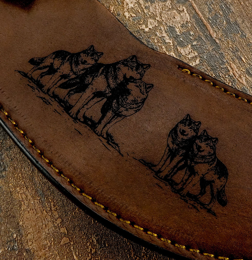 Thumbnail: Each wolf is rendered with dark, detailed linework that creates striking contrast against the warm brown leather, capturing m