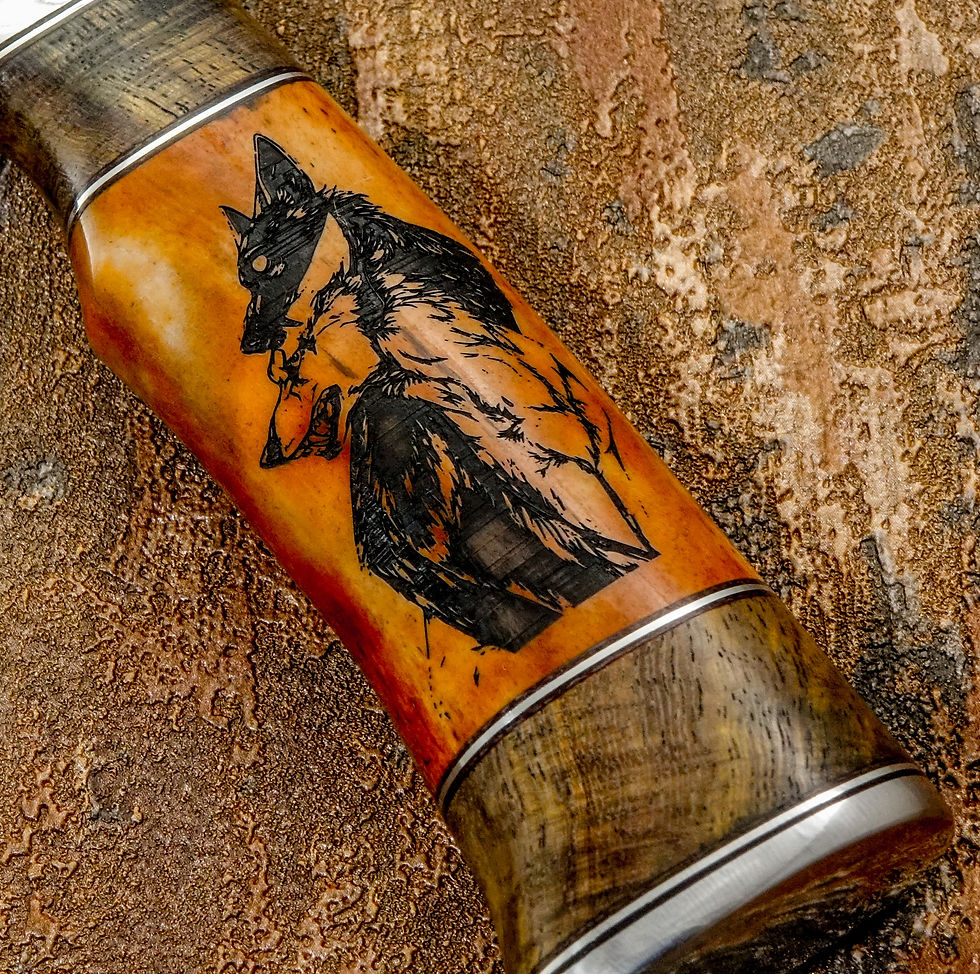 Thumbnail: The camel bone handle features a deeply engraved wolf motif, captured mid-profile with intense expression and flowing lines