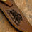 Thumbnail: Leather sheath engraved with a wild boar, complementing the knife’s hunting theme