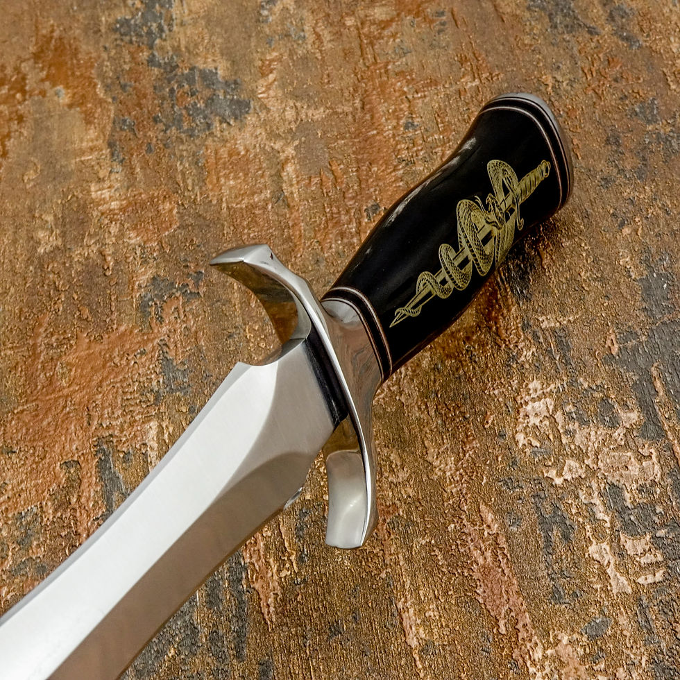 Thumbnail: engraved buffalo horn and polished stainless steel fittings, results in a knife that feels balanced, authoritative, and purpo