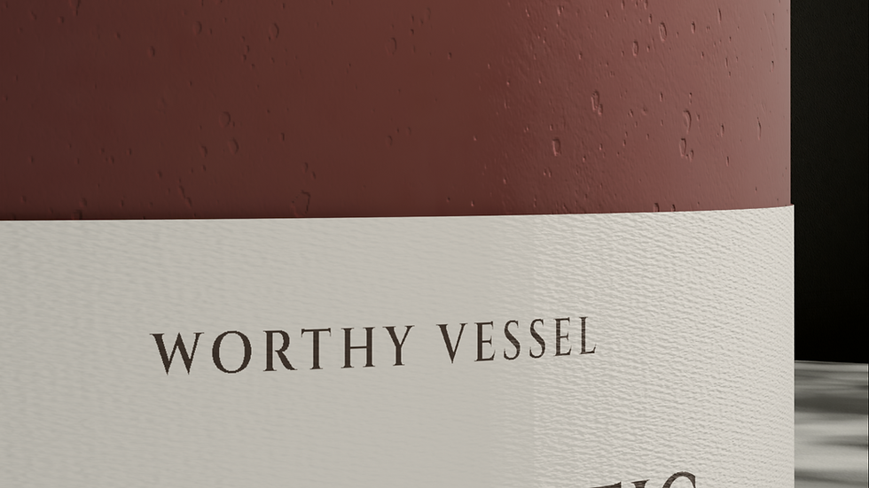 Close-up of a textured paper label on a luxury candle vessel