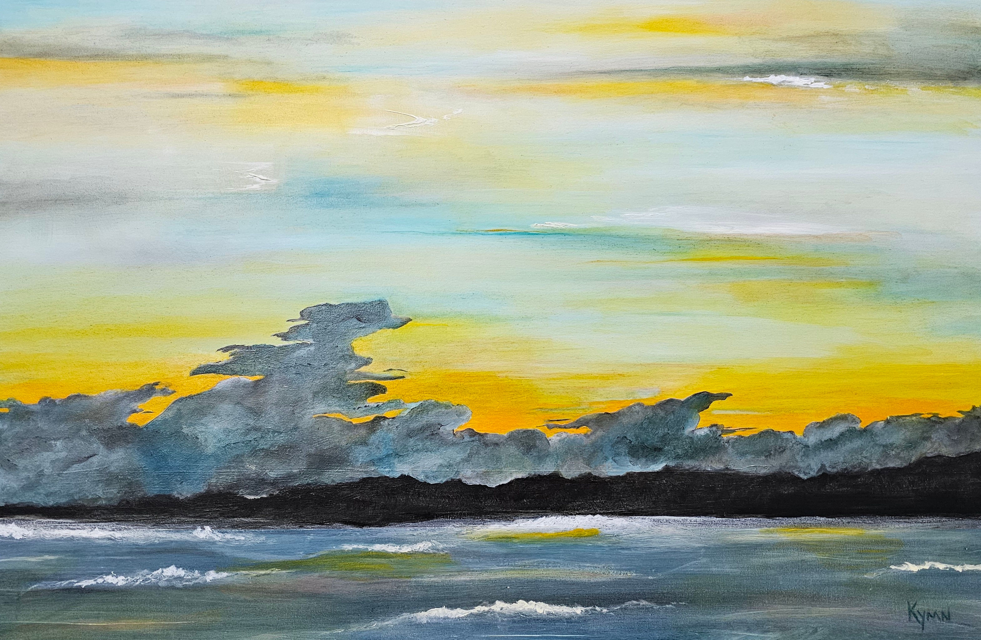 Sunset with yellow, blue, and white skies over water.