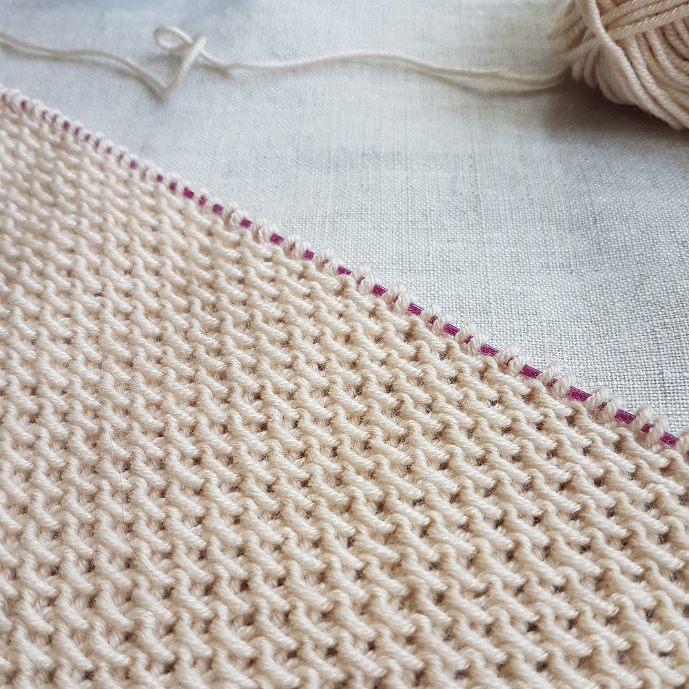 A close up of knitting on the needles