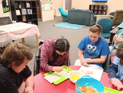 Lexington Services DTA Show Low Members at the facility making egg rolls