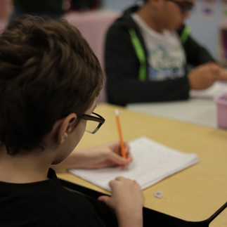 Student completing a written classroom assignment at Achieve School for Autism.