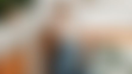 Woman on couch with runny nose from allergies