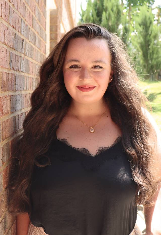Professional headshot of a bald man for Meet Our Team