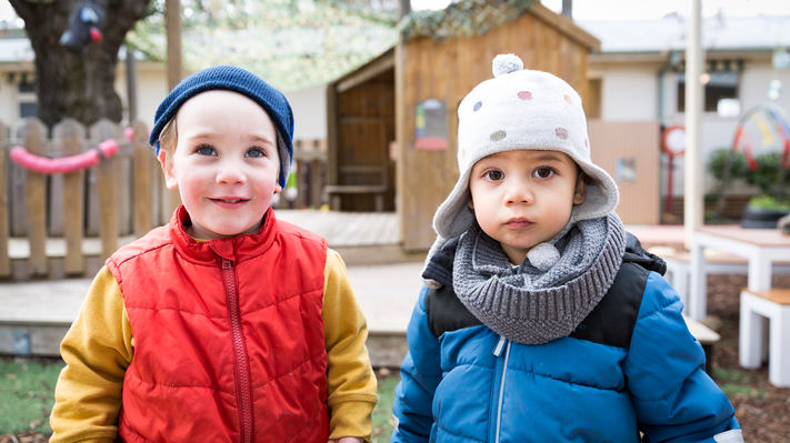 Two young boys outside at daycare