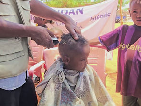 Fresh Cuts, Brighter Futures: Orphans Smile Back at Themselves