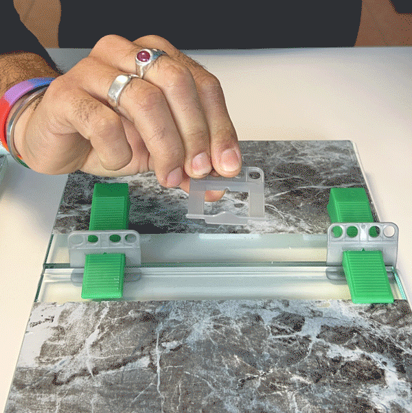 Matrix Emergency Leveler replacement clip installed between tiles without removing the tile