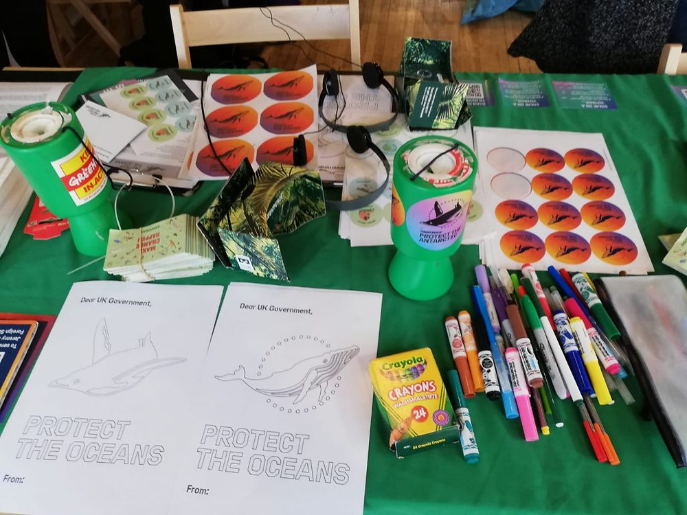 A table with various craft activities surrounding the theme of protecting the oceans.