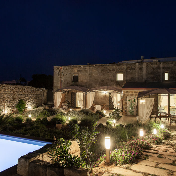 masseria palane at night with lights illuminating the property